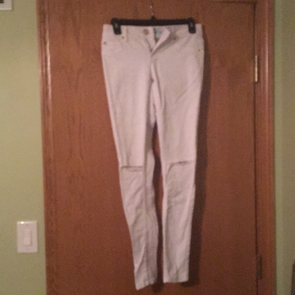 White pants with knee holes